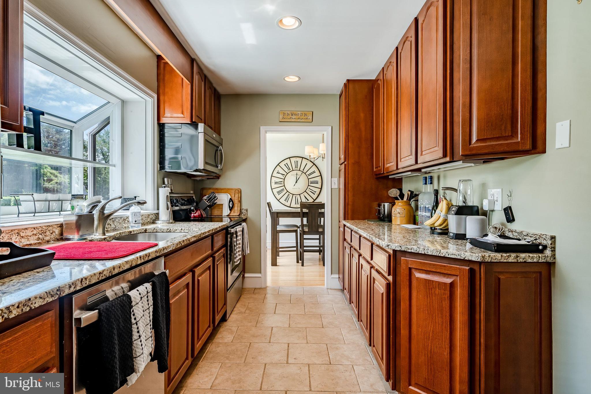 1538 Carmac Road West Chester, PA 19382 - Photo 18 of 33 a kitchen with stainless steel appliances granite countertop a stove a sink and dishwasher