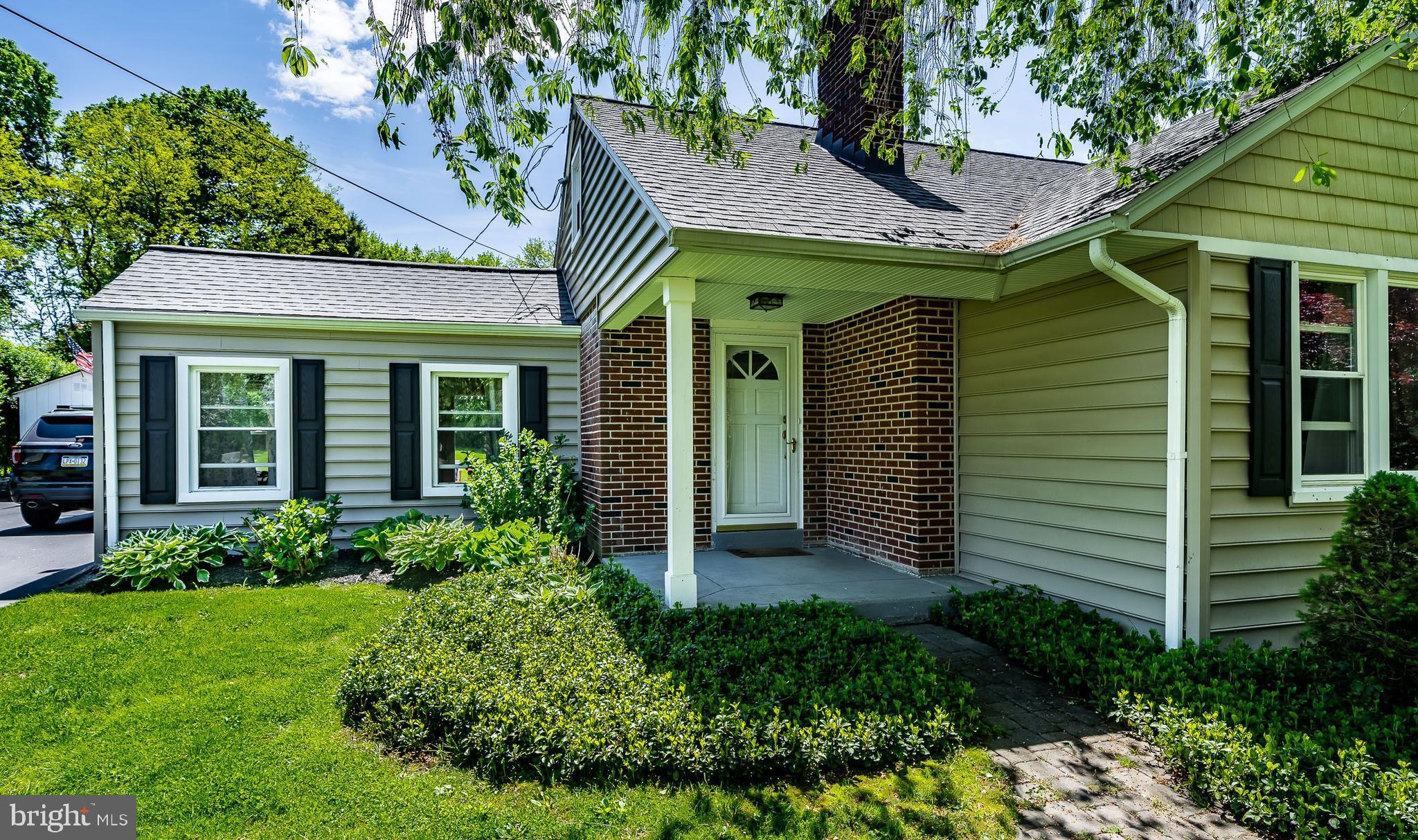 1538 Carmac Road West Chester, PA 19382 - Photo 3 of 33 a front view of a house with a garden