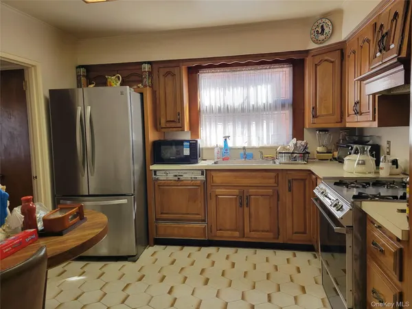 a kitchen with a sink stove and refrigerator