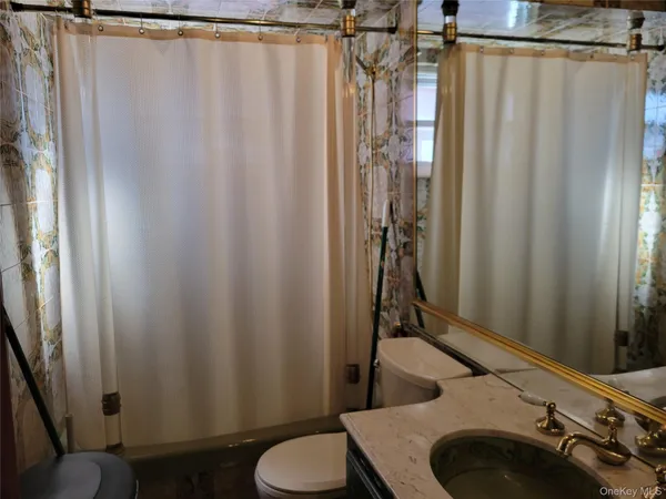 a bathroom with a sink and toilet