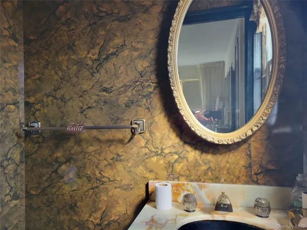 a bathroom with a tub and mirror