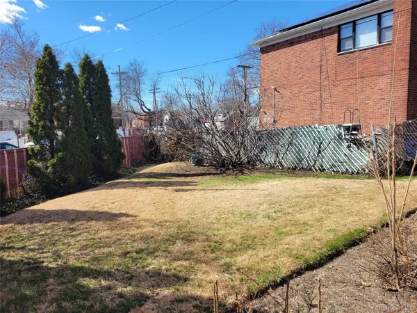 a view of a backyard of the house