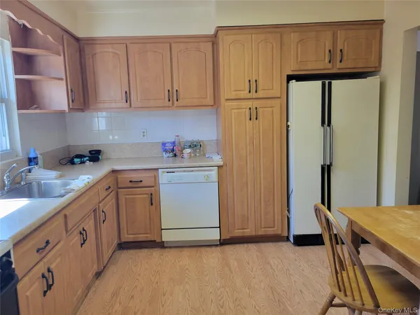 a kitchen with sink cabinets and utility