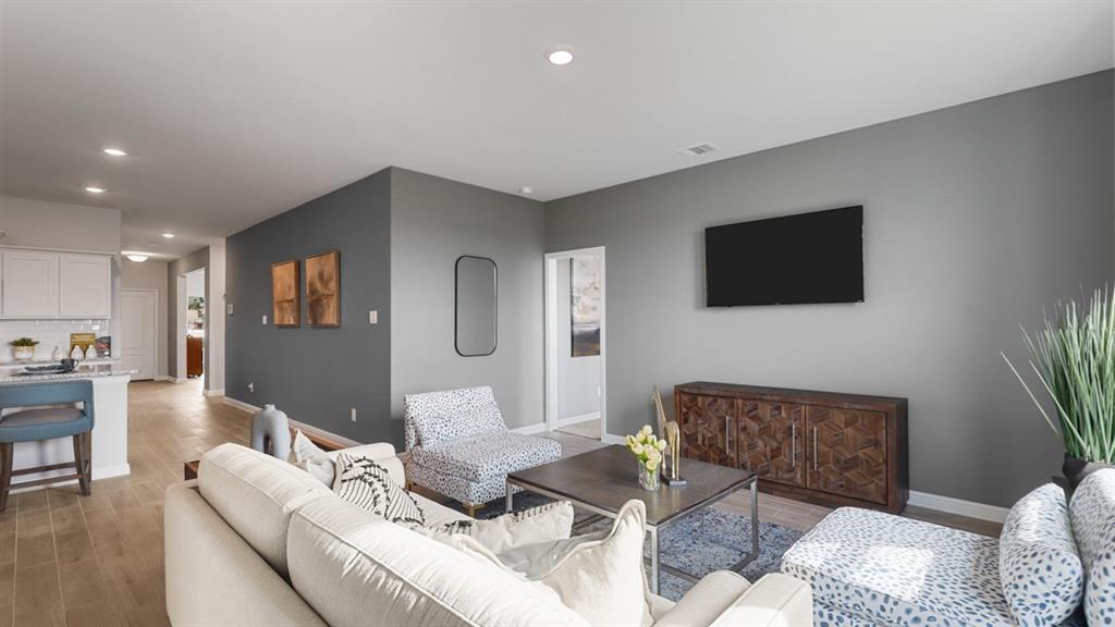 317 Potato Street Keene, TX 76059 - Photo 13 of 36 a living room with furniture and a flat screen tv