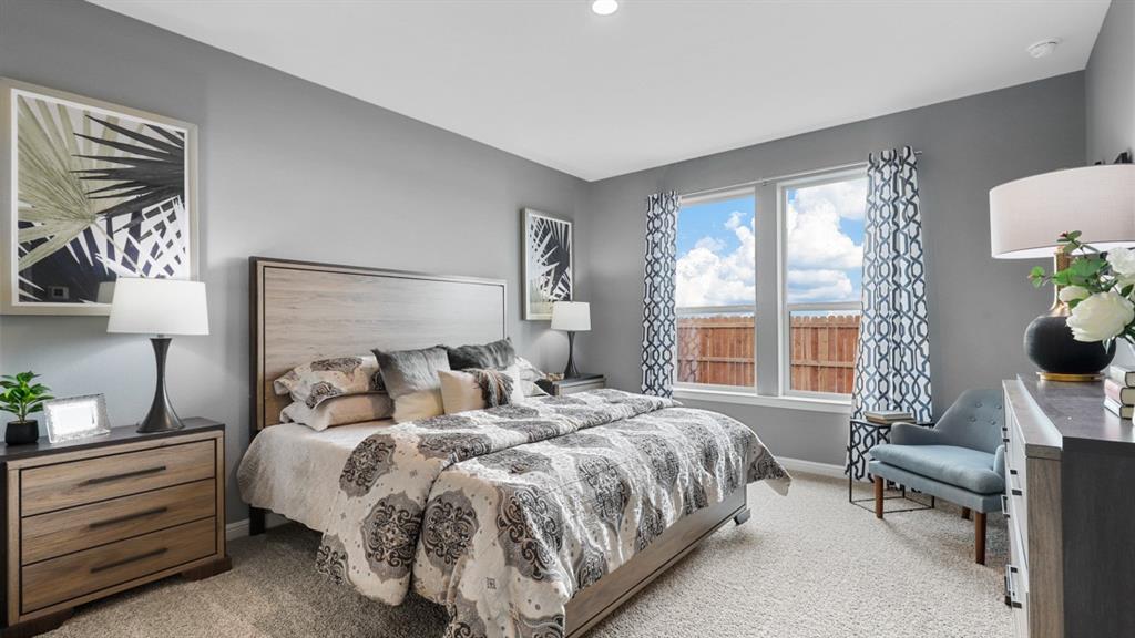 317 Potato Street Keene, TX 76059 - Photo 14 of 36 a bedroom with a bed and a chair