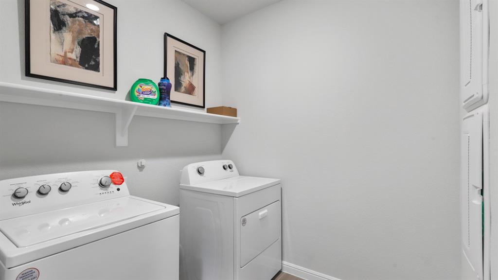 317 Potato Street Keene, TX 76059 - Photo 29 of 36 a utility room with dryer and washer