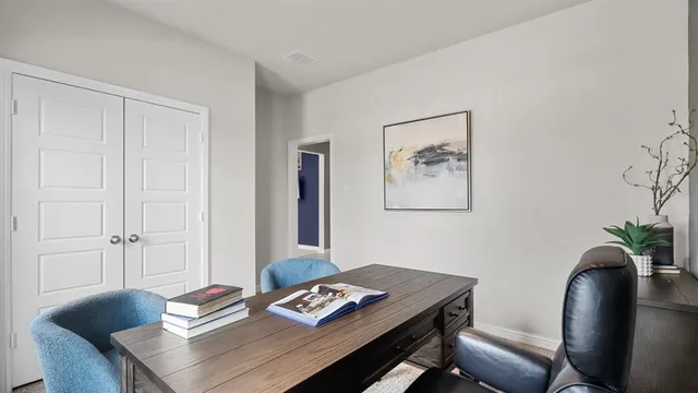 a workspace with furniture and window