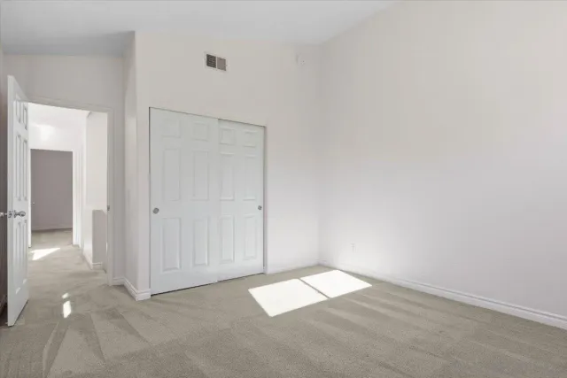 an empty room with a bathroom