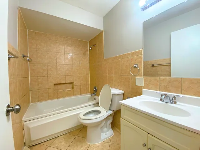 a bathroom with a sink a toilet and a bathtub