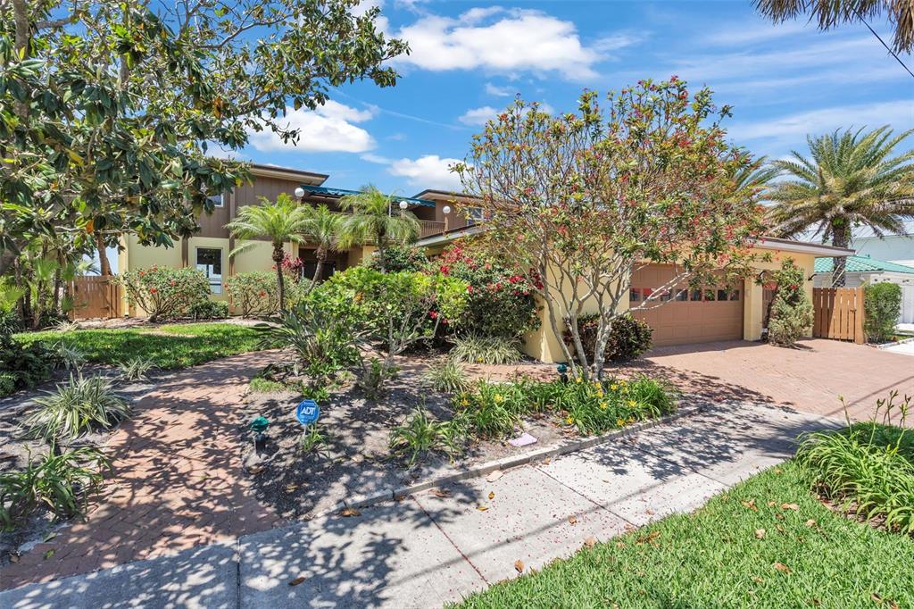1058 Eldorado Avenue Clearwater Beach, FL 33767 - Photo 11 of 79 a view of bushes and pathway