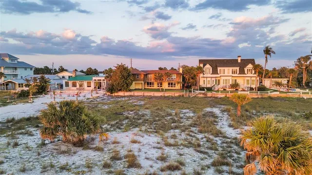 a view of a lake with a house in the background