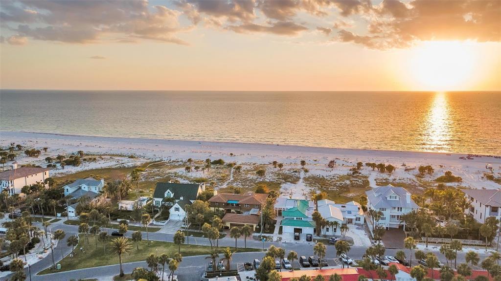 1058 Eldorado Avenue Clearwater Beach, FL 33767 - Photo 37 of 79 an aerial view of ocean and residential houses with outdoor space