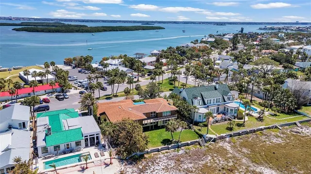 an aerial view of a houses with a lake view