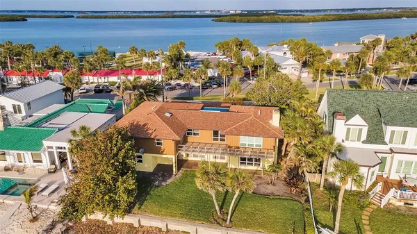 an empty room with a window and a ceiling fan