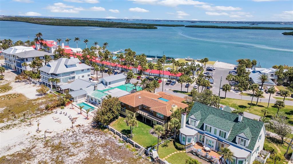 1058 Eldorado Avenue Clearwater Beach, FL 33767 - Photo 5 of 79 an aerial view of a houses with outdoor seating