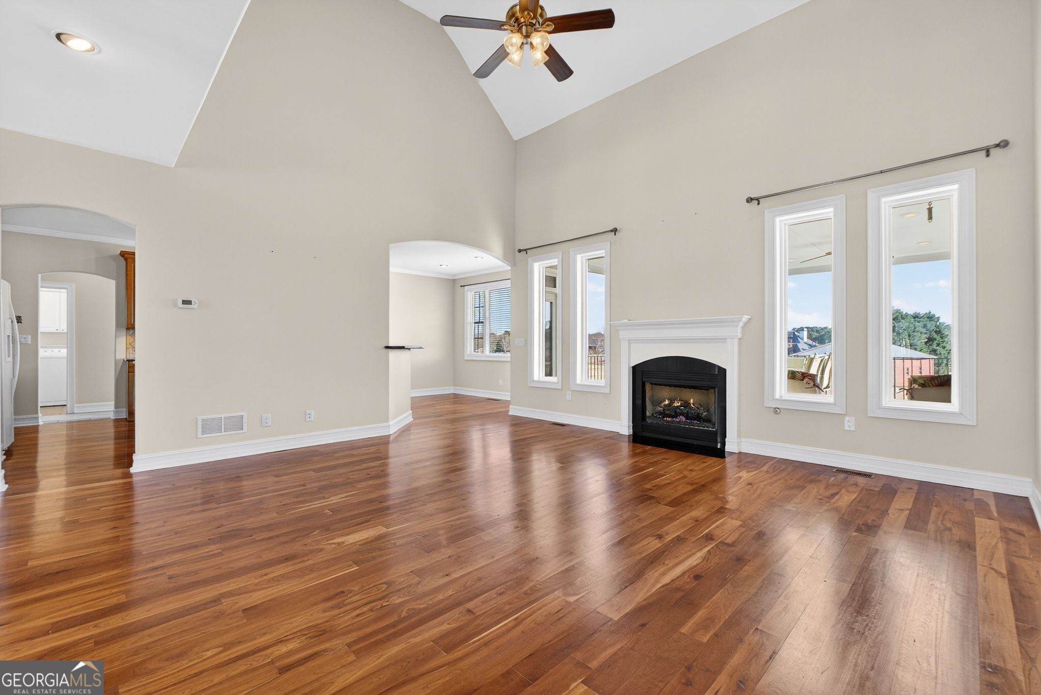 357 Canvasback Trail Locust Grove, GA 30248 - Photo 11 of 35 a view of empty room with fireplace and wooden floor