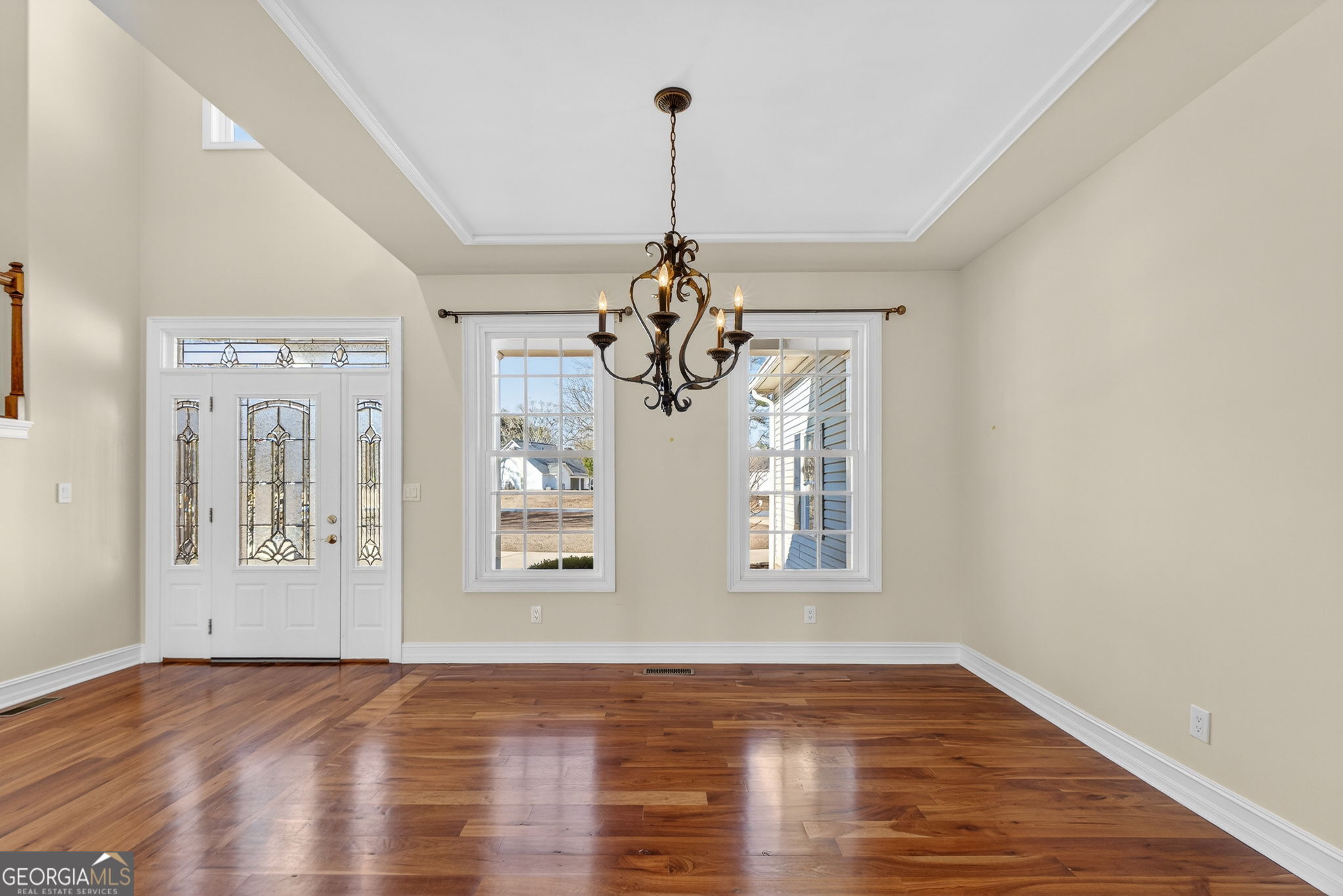 357 Canvasback Trail Locust Grove, GA 30248 - Photo 14 of 35 a view of a room with wooden floor chandelier and windows