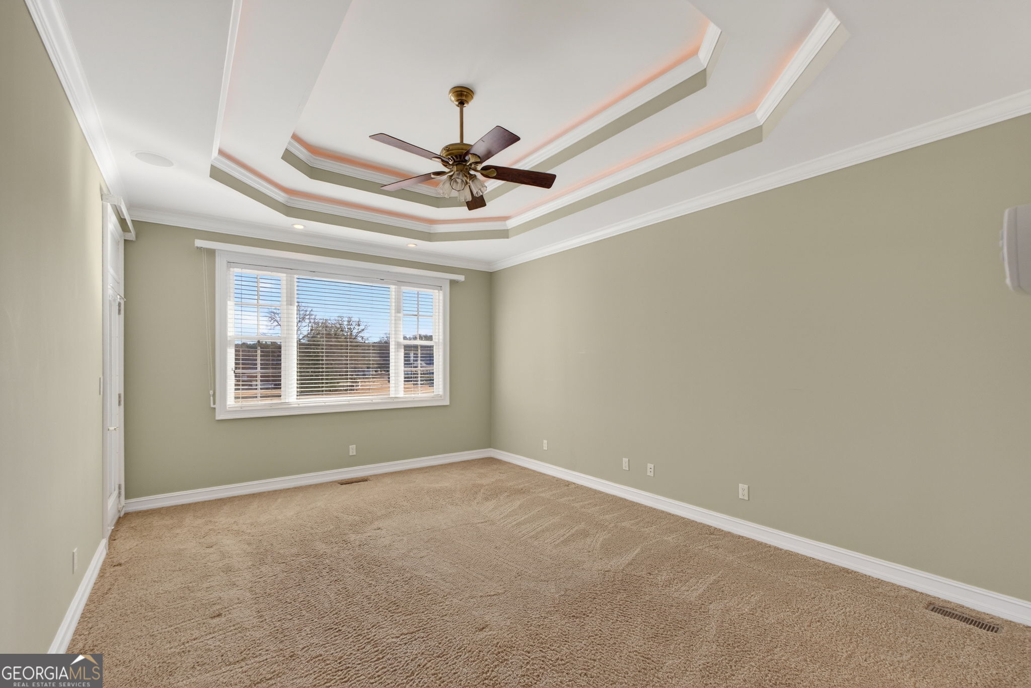 357 Canvasback Trail Locust Grove, GA 30248 - Photo 15 of 35 an empty room with windows and fan