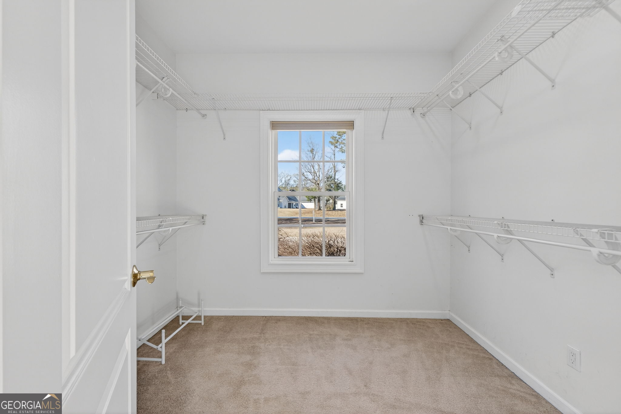 357 Canvasback Trail Locust Grove, GA 30248 - Photo 18 of 35 a view of an empty room with a window