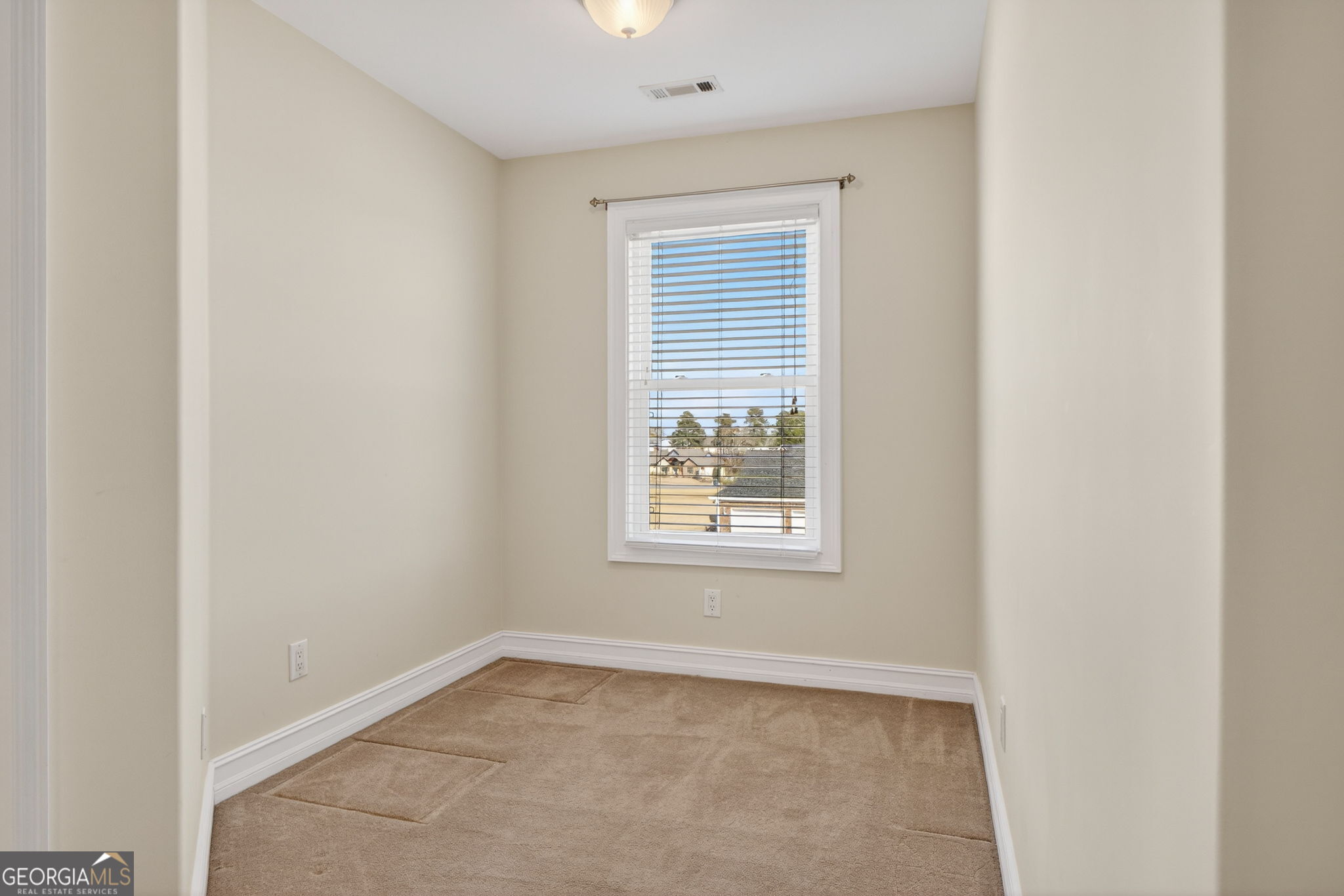 357 Canvasback Trail Locust Grove, GA 30248 - Photo 23 of 35 an empty room with a window