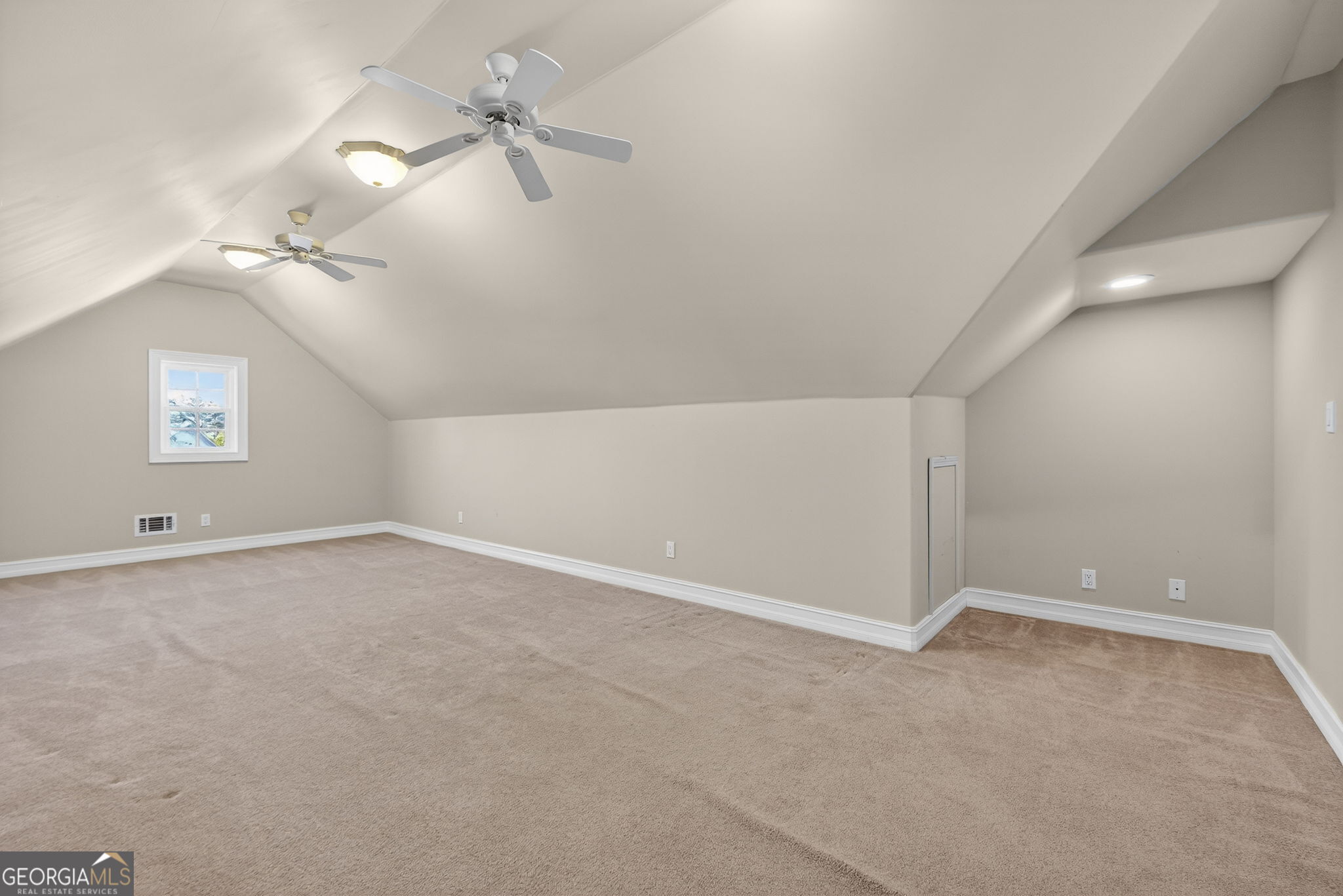 357 Canvasback Trail Locust Grove, GA 30248 - Photo 24 of 35 a view of an empty room with a window