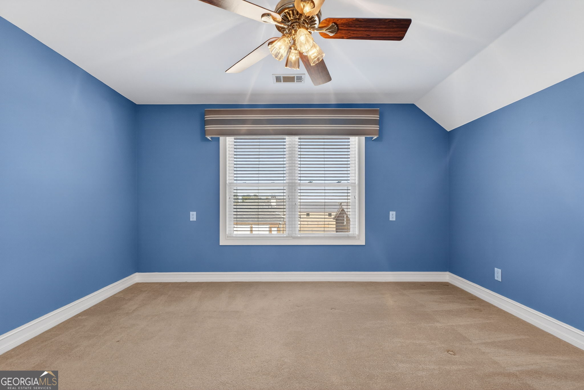 357 Canvasback Trail Locust Grove, GA 30248 - Photo 25 of 35 an empty room with a window and a ceiling fan