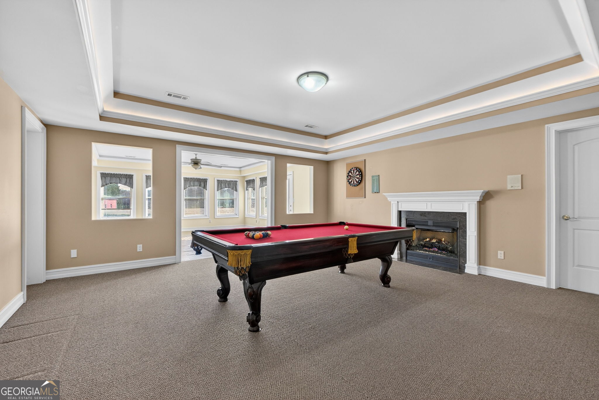 357 Canvasback Trail Locust Grove, GA 30248 - Photo 27 of 35 a living room with a pool table and a fireplace