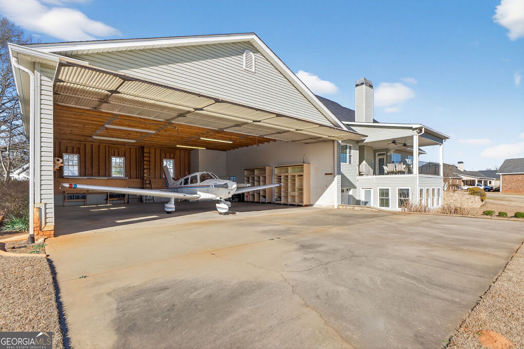 357 Canvasback Trail Locust Grove, GA 30248 - Photo 33 of 35 a view of a building with car parked