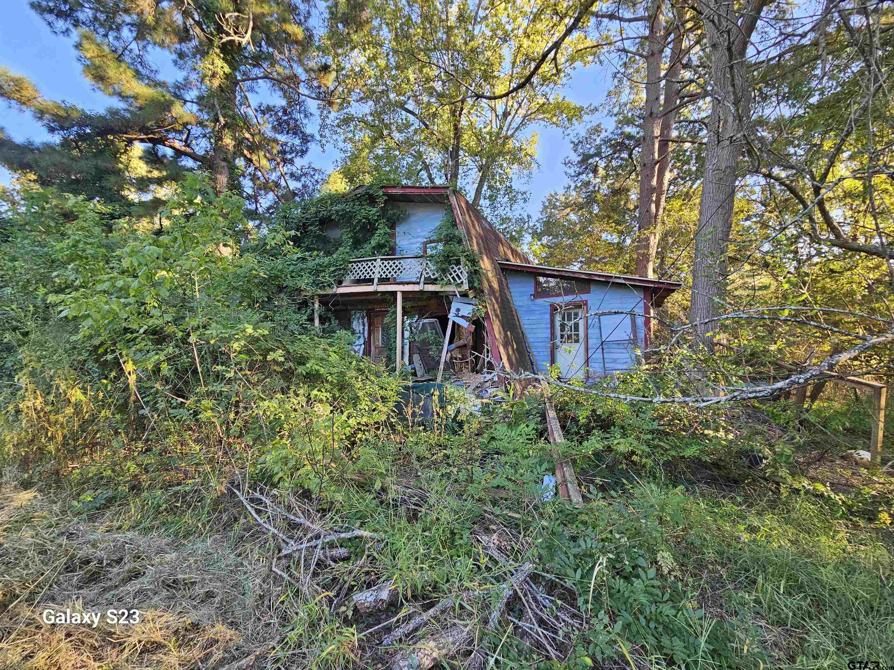15830 Shady Creek Road Tyler, TX 75705 - Photo 14 of 32 a house that has a tree in front of it