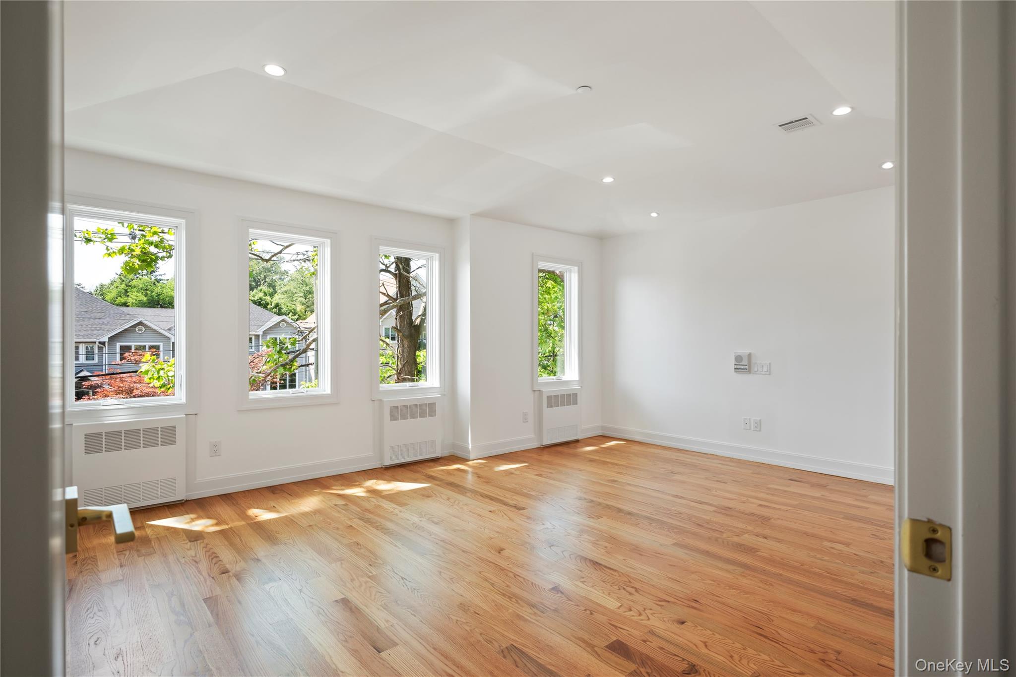 128 Union Road, Unit 201 Spring Valley, NY 10977 - Photo 24 of 48 Spare room featuring light wood-type flooring, recessed lighting, and radiator