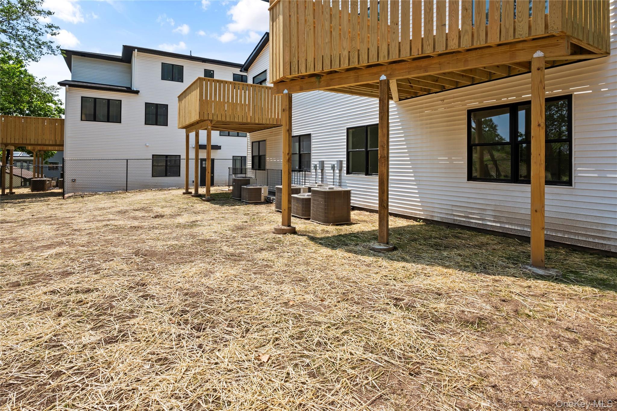 128 Union Road, Unit 201 Spring Valley, NY 10977 - Photo 40 of 48 View of yard featuring a patio and a deck
