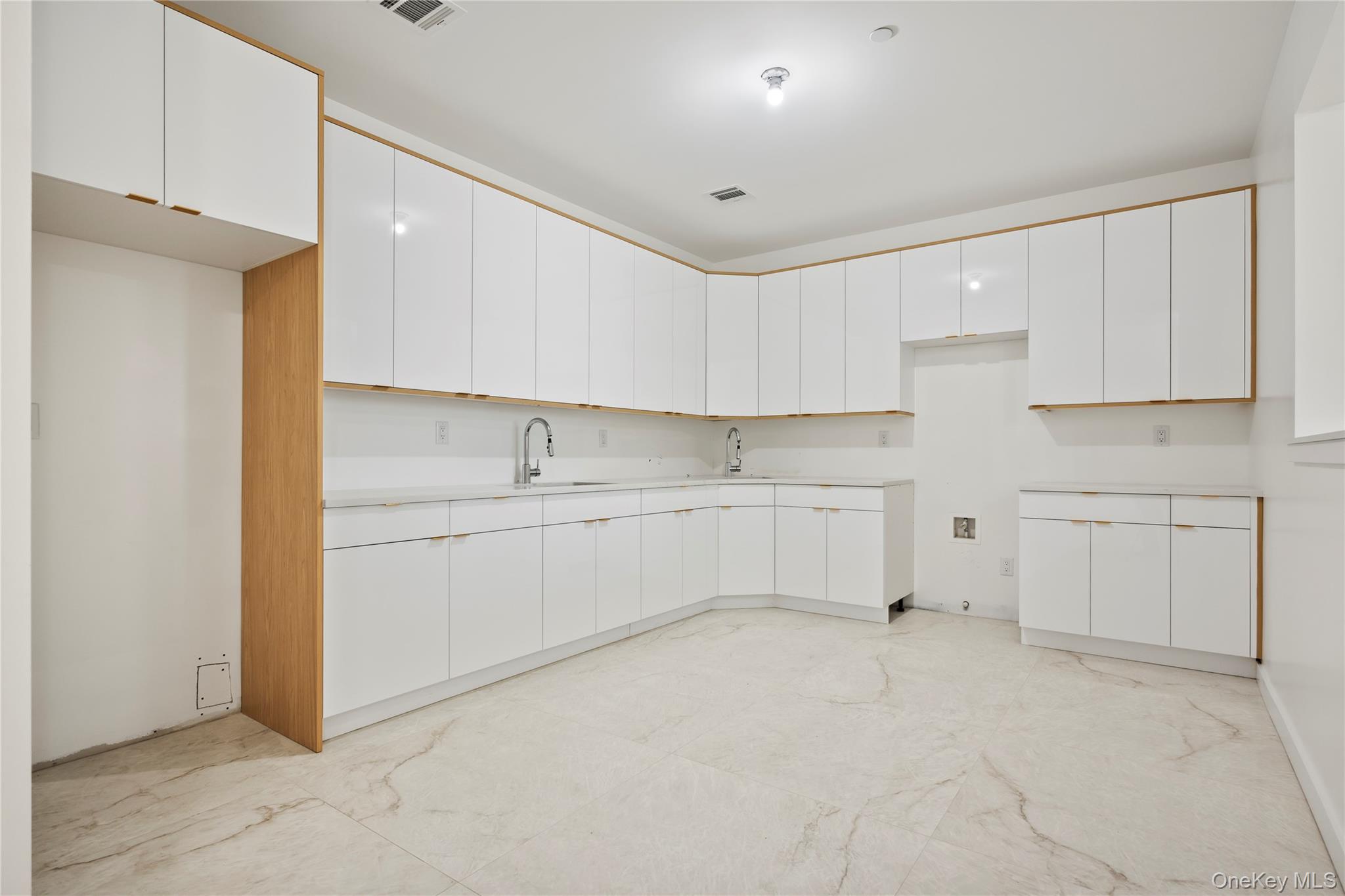 128 Union Road, Unit 201 Spring Valley, NY 10977 - Photo 42 of 48 Kitchen featuring white cabinets, light countertops, and modern cabinets