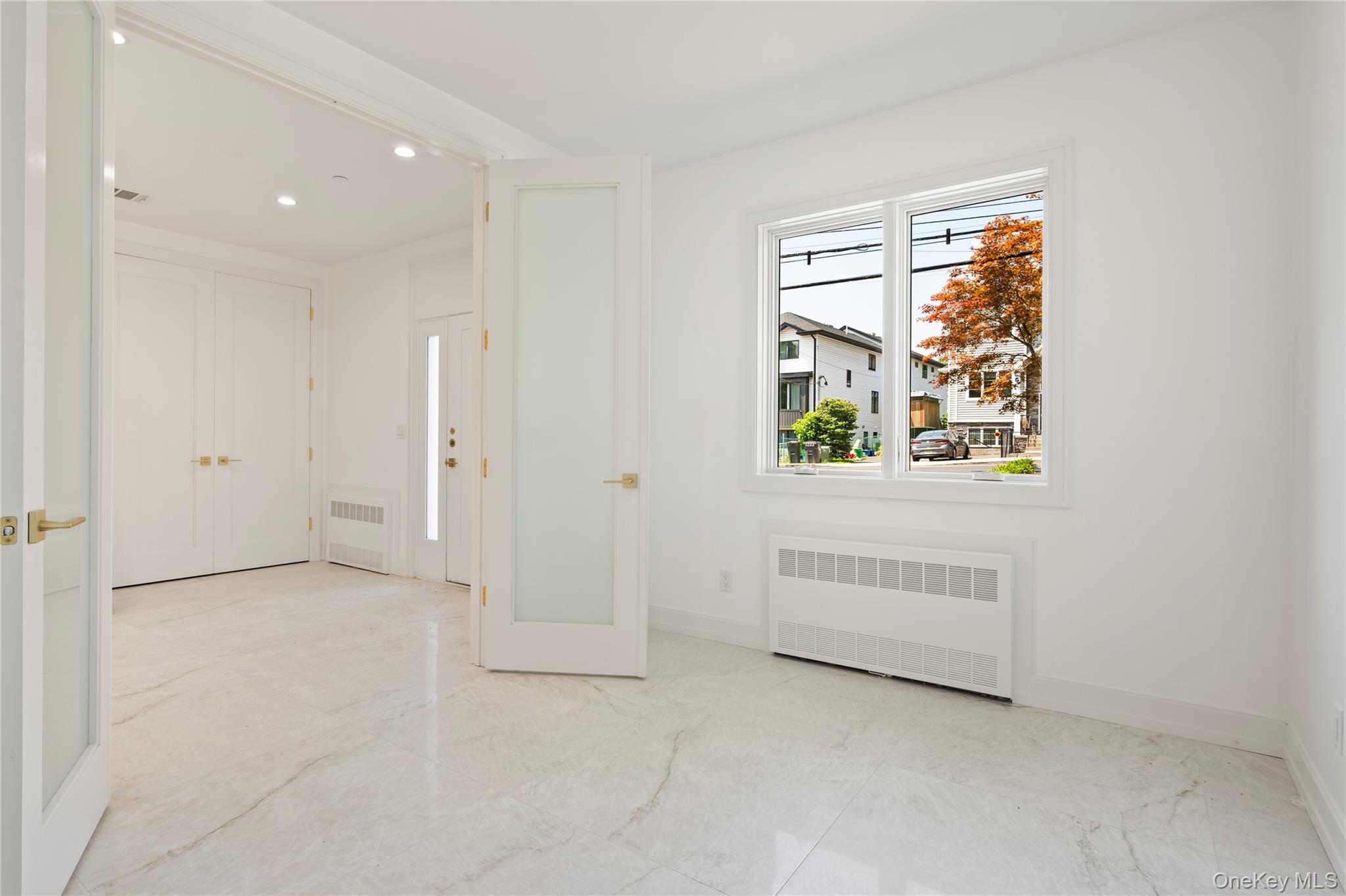 128 Union Road, Unit 201 Spring Valley, NY 10977 - Photo 7 of 48 Foyer entrance with radiator and recessed lighting