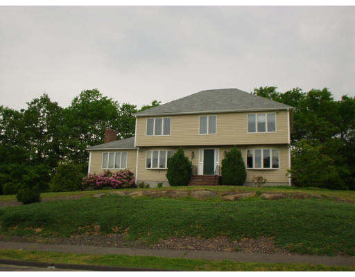 2 Juniper Road Sharon, MA 02067 - Photo 1 of 1 a front view of a house with a garden and plants