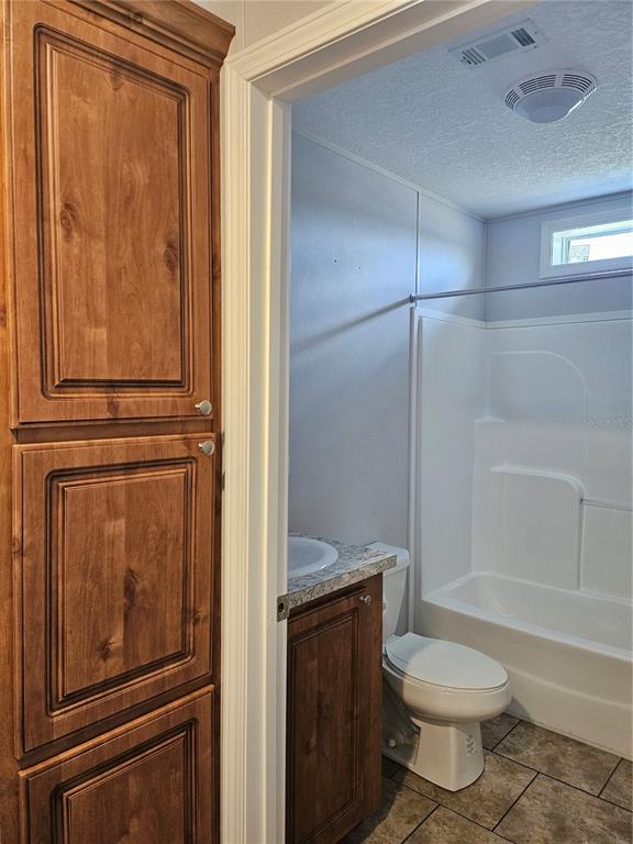 5636 West O Griffin Road Plant City, FL 33567 - Photo 18 of 20 a bathroom with a toilet and a shower