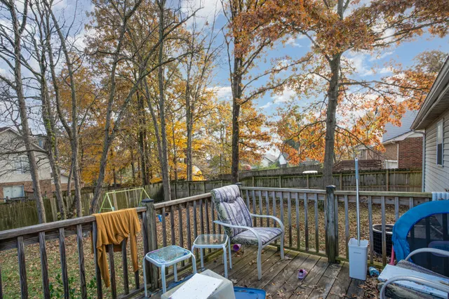 a view of a chair and tables on the deck