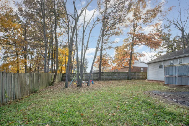 a backyard of a house with lots of green space