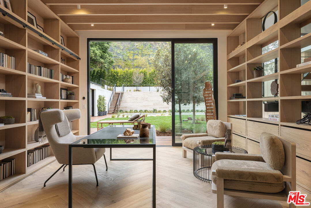 16036 Woodvale Road Encino, CA 91436 - Photo 15 of 54 a living room with furniture and a window