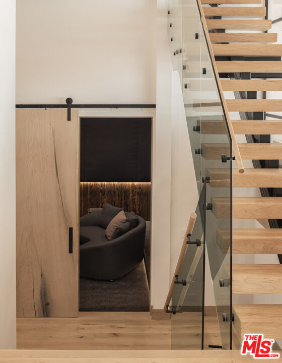16036 Woodvale Road Encino, CA 91436 - Photo 20 of 54 a living room with furniture and a flat screen tv