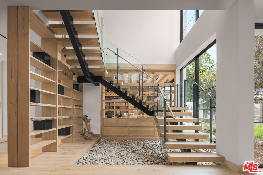 16036 Woodvale Road Encino, CA 91436 - Photo 23 of 54 a view of entryway and hall with wooden floor