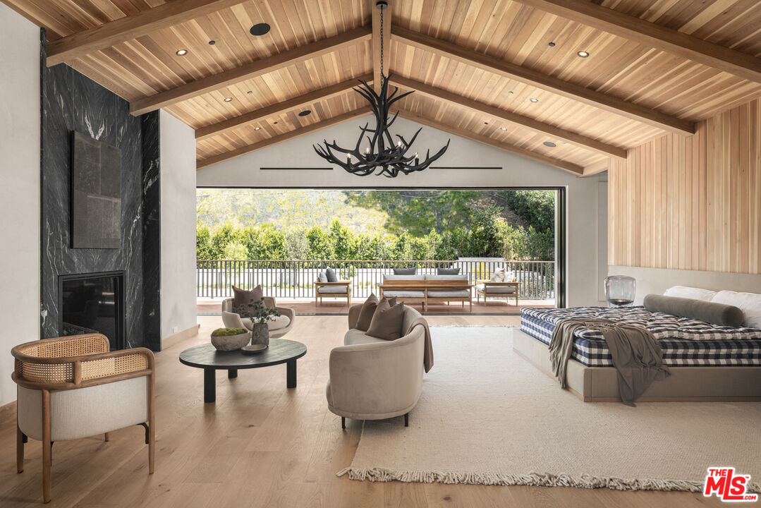 16036 Woodvale Road Encino, CA 91436 - Photo 27 of 54 a living room with furniture and a large window