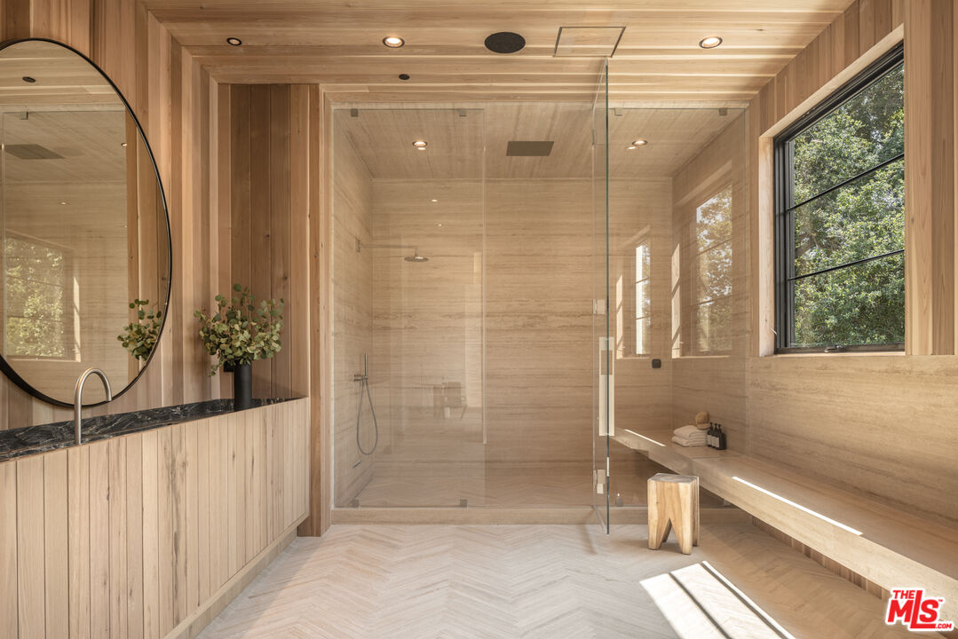 16036 Woodvale Road Encino, CA 91436 - Photo 32 of 54 a bathroom with a shower and a sink