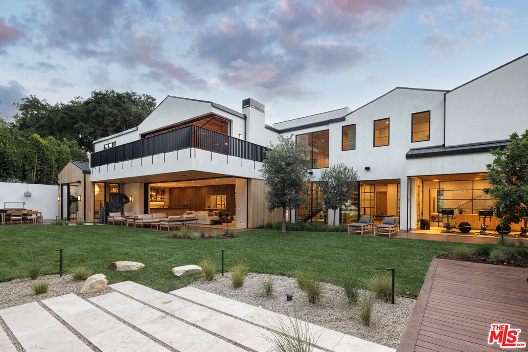 16036 Woodvale Road Encino, CA 91436 - Photo 48 of 54 a front view of a house with garden