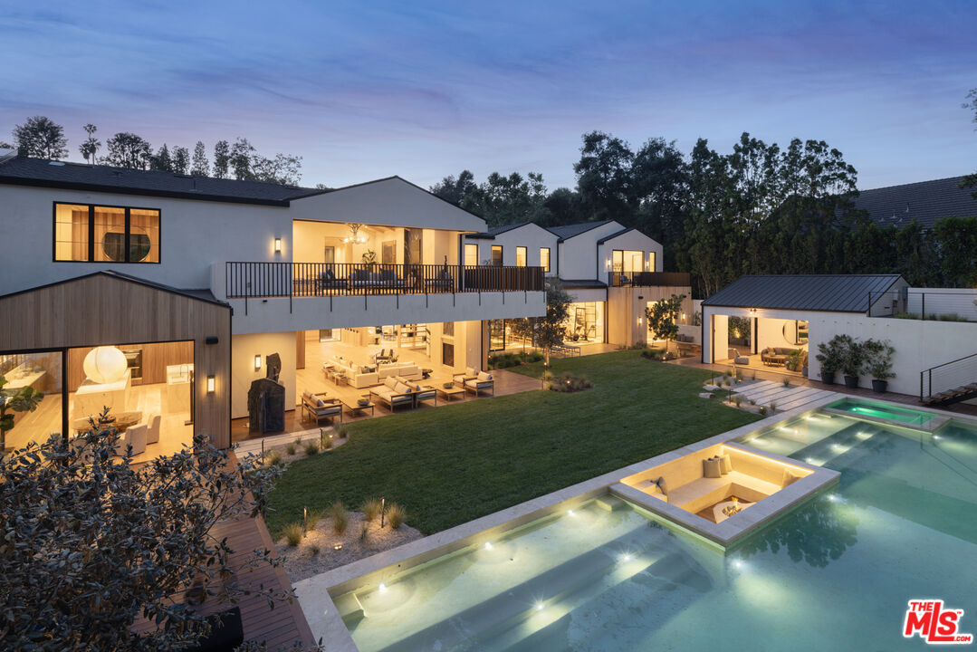 16036 Woodvale Road Encino, CA 91436 - Photo 49 of 54 a view of a house with a yard