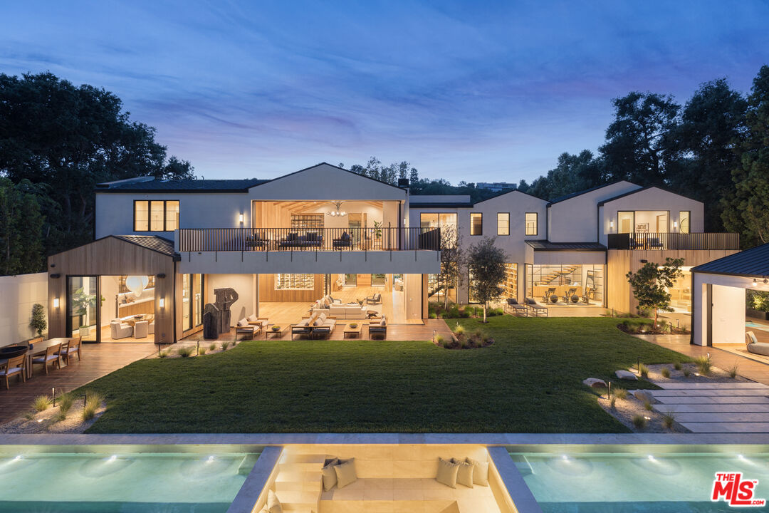 16036 Woodvale Road Encino, CA 91436 - Photo 50 of 54 a view of a house with swimming pool