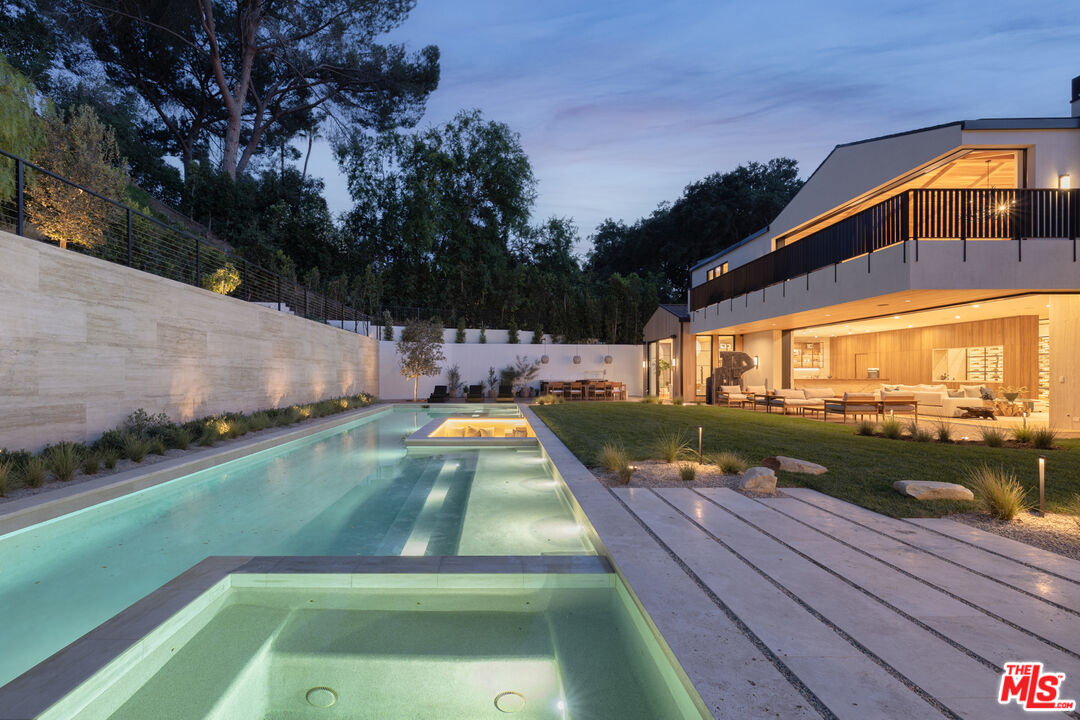 16036 Woodvale Road Encino, CA 91436 - Photo 51 of 54 a view of swimming pool with a patio