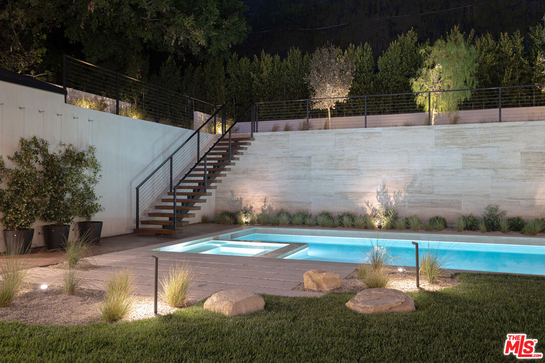 16036 Woodvale Road Encino, CA 91436 - Photo 52 of 54 a view of a backyard with swimming pool