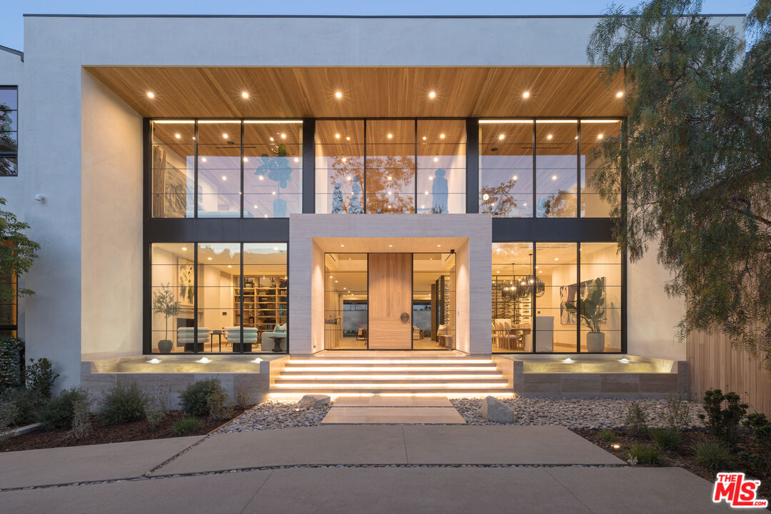 16036 Woodvale Road Encino, CA 91436 - Photo 54 of 54 a view of building with a garden and pathway