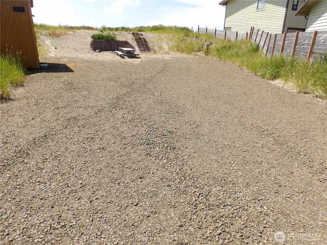 a view of a road with an ocean view