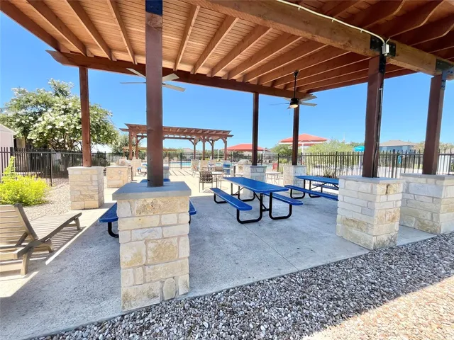 a view of a backyard with a patio